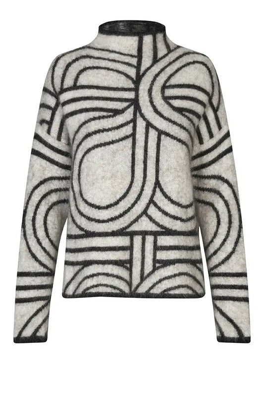 Bílý vzorovaný svetr s mohérem